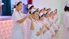 爱心传承红烛精神 奉献点亮光明前程——广西中医学校2016年5·12国际护士节授帽仪式